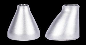 Stainless steel concentric reducer (left) and eccentric reducer (right) side by side, showing the symmetric cone versus the one flat side.