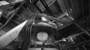Boiler house interior with steel platforms and steam piping