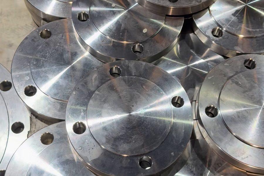 Machined stainless steel blind flanges with bolt holes